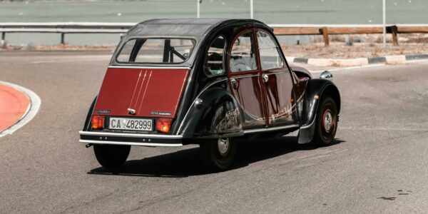 pexels-photo-28764297-28764297 A classic Citroën 2CV car navigating the streets of Cagliari, Sardinia, Italy.